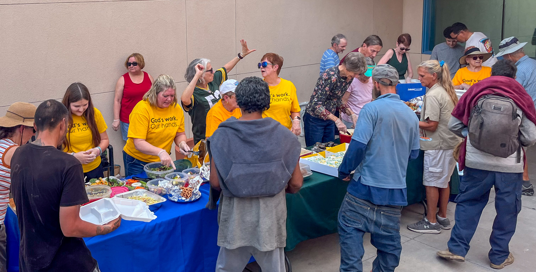 Church members serving meals to locals in need.